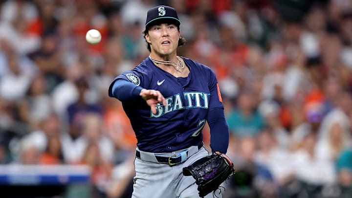 Sep 19, 2025; Houston, Texas, USA; Seattle Mariners pitcher Bryan Woo (22) throws a fielded ball to first base for an out against the Houston Astros during the second inning at Daikin Park. Mandatory Credit: Erik Williams-Imagn Images Sep 19, 2025; Houston, Texas, USA; Seattle Mariners pitcher Bryan Woo (22) throws a fielded ball to first base for an out against the Houston Astros during the second inning at Daikin Park. Mandatory Credit: Erik Williams-Imagn Images