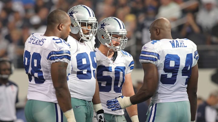 Oct 23, 2011; Arlington, TX, USA; Dallas Cowboys defensive end Marcus Spears (98), defensive end Kenyon Coleman (99), linebacker Sean Lee (50) and linebacker DeMarcus Ware talk during a timeout in the third quarter of the game against the St Louis Rams at Cowboys Stadium. The Cowboys beat the Rams 34-7. Mandatory Credit: Tim Heitman-Imagn Images