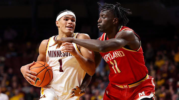 Feb 8, 2026; Minneapolis, Minnesota, USA; Minnesota Golden Gophers guard Isaac Asuma (1) works around Maryland Terrapins guard George Turkson Jr. (11) during the first half at Williams Arena. Mandatory Credit: Matt Krohn-Imagn Images