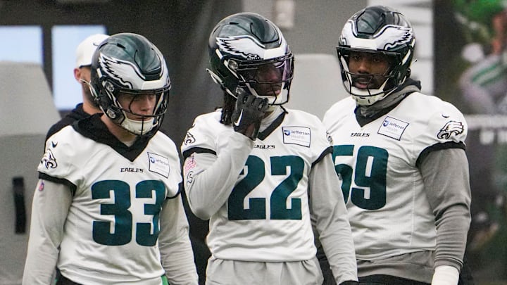 Defensive back Cooper DeJean (33) and cornerback Kelee Ringo (22) take part in warmups with defensive tackle Thomas Booker as the Philadelphia Eagles work out in preparation for the Super Bowl at the NovaCare Complex in Philadelphia on Jan. 31, 2025.