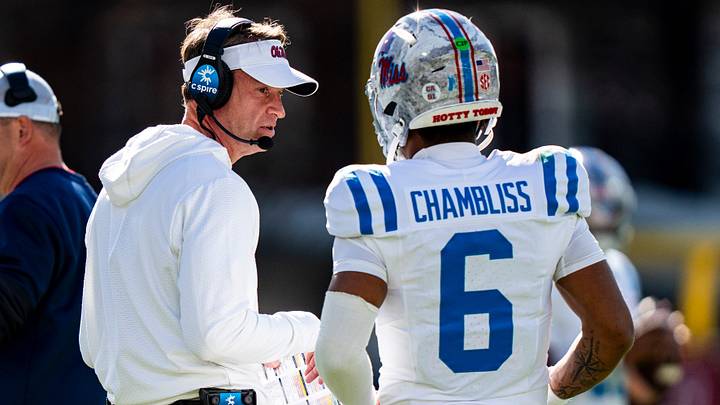 Ole Miss head coach Lane Kiffin talks with quarterback Trinidad Chambliss (6) during a college football game between Mississippi State and Ole Miss at Davis Wade Stadium in Starkville, Miss., on Friday, Nov. 28, 2025. Ole Miss defeated Mississippi State 38-19 in the Egg Bowl. Ole Miss head coach Lane Kiffin talks with quarterback Trinidad Chambliss (6) during a college football game between Mississippi State and Ole Miss at Davis Wade Stadium in Starkville, Miss., on Friday, Nov. 28, 2025. Ole Miss defeated Mississippi State 38-19 in the Egg Bowl.