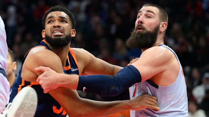 Dec 30, 2024; Washington, District of Columbia, USA; New York Knicks center Karl-Anthony Towns (32) and Washington Wizards center Jonas Valanciunas (17) fight for position during the second quarter at Capital One Arena. Mandatory Credit: Reggie Hildred-Imagn Images