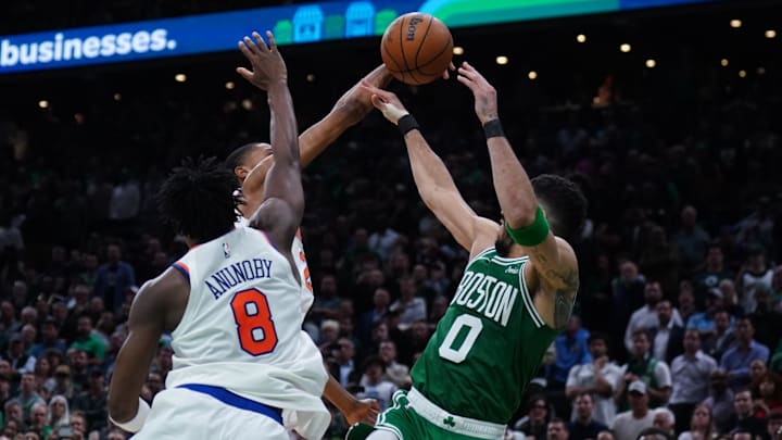 May 7, 2025; Boston, Massachusetts, USA; New York Knicks forward Mikal Bridges (25) defends against Boston Celtics forward Jayson Tatum (0) in the last seconds of the fourth quarter during game two of the second round for the 2025 NBA Playoffs at TD Garden. Mandatory Credit: David Butler II-Imagn Images