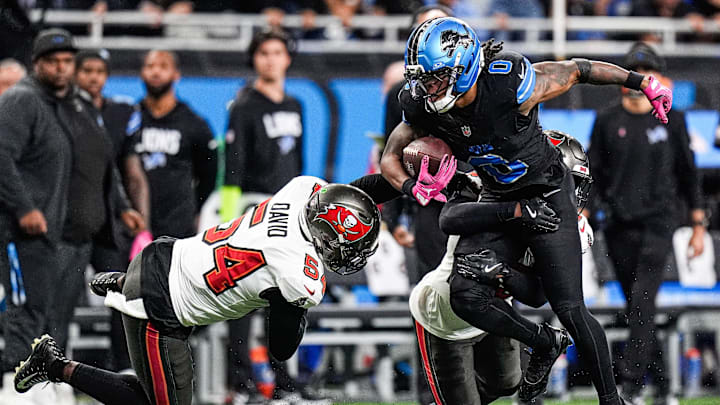Detroit Lions running back Jahmyr Gibbs (0) runs against Tampa Bay Buccaneers safety Tykee Smith