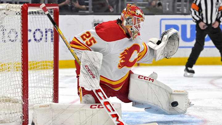 Apr 11, 2024; Los Angeles, California, USA; Calgary Flames goaltender Jacob Markstrom (25) makes a save in the second period against the Los Angeles Kings at Crypto.com Arena. Mandatory Credit: Jayne Kamin-Oncea-Imagn Images