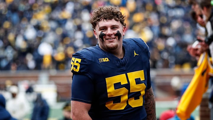Blue Team defensive lineman Mason Graham (55) walks up the tunnel for halftime during the spring game at Michigan Stadium in Ann Arbor on Saturday, April 20, 2024.