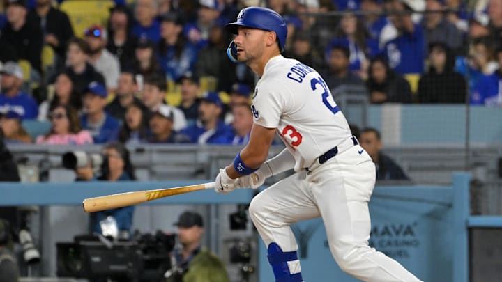 Mar 31, 2025; Los Angeles, California, USA; Los Angeles Dodgers outfielder Michael Conforto (23) hits a RBI double during the third inning against the Atlanta Braves at Dodger Stadium. Mandatory Credit: Jayne Kamin-Oncea-Imagn Images