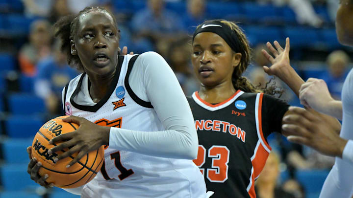 Mar 21, 2026; Los Angeles, CA, USA; Oklahoma State Cowboys forward Achol Akot (11) beats Princeton Tigers guard Madison St. Rose (23) to a rebound in the first half at Pauley Pavilion. Mandatory Credit: Jayne Kamin-Oncea-Imagn Images Mar 21, 2026; Los Angeles, CA, USA; Oklahoma State Cowboys forward Achol Akot (11) beats Princeton Tigers guard Madison St. Rose (23) to a rebound in the first half at Pauley Pavilion. Mandatory Credit: Jayne Kamin-Oncea-Imagn Images