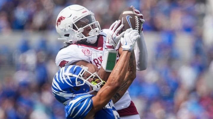 Memphis' Marcello Bussey (6) has the ball pulled out of his hands by Arkansas' Julian Neal (23) during the game between Memphis and Arkansas at Simmons Bank Liberty Stadium in Memphis, Tenn., on September 20, 2025.