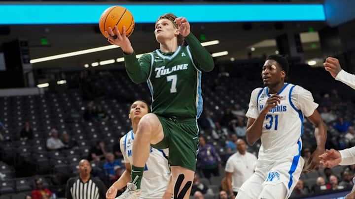 Tulane's Rowan Brumbaugh (7) goes for a layup during the first round American Conference Tournament game between Memphis and Tulane in Birmingham, Ala, on March 11, 2026. Tulane's Rowan Brumbaugh (7) goes for a layup during the first round American Conference Tournament game between Memphis and Tulane in Birmingham, Ala, on March 11, 2026.