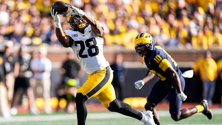 Iowa running back Kamari Moulton makes a catch against Michigan cornerback Zeke Berry during the first half Iowa running back Kamari Moulton makes a catch against Michigan cornerback Zeke Berry during the first half