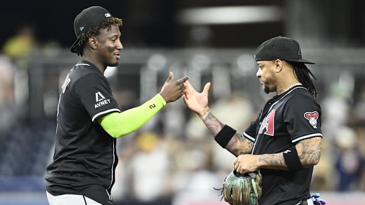 Jul 9, 2025; San Diego, California, USA; Arizona Diamondbacks shortstop Geraldo Perdomo (2) and Ketel Marte (4) celebrate after the Diamondbacks defeated the San Diego Padres at Petco Park. Mandatory Credit: Denis Poroy-Imagn Images