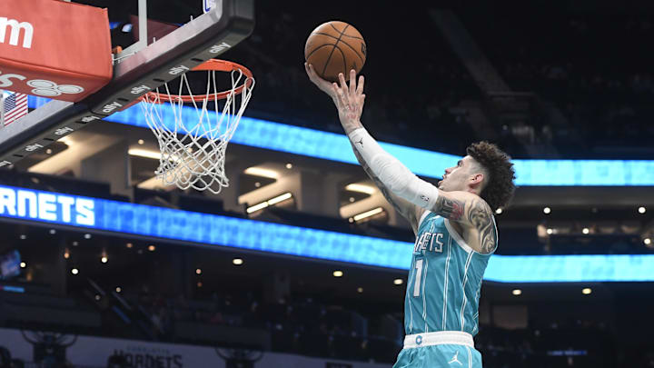 Dec 16, 2024; Charlotte, North Carolina, USA;  Charlotte Hornets guard LaMelo Ball (1) drives in during the second half against the Philadelphia 76ers at the Spectrum Center. Mandatory Credit: Sam Sharpe-Imagn Images