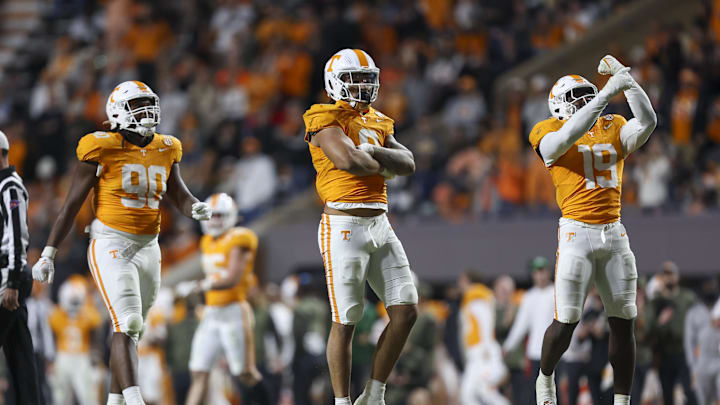 Nov 25, 2023; Knoxville, Tennessee, USA; Tennessee Volunteers defensive lineman Dominic Bailey (90) and defensive lineman Tyler Baron (9) and defensive lineman Joshua Josephs (19) celebrate after a sack against the Vanderbilt Commodores during the second half at Neyland Stadium. Mandatory Credit: Randy Sartin-USA TODAY Sports