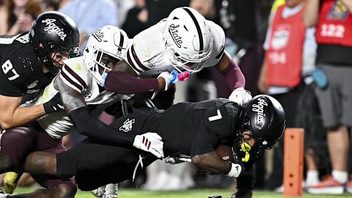 Oct 4, 2025; College Station, Texas, USA; Texas A&M Aggies wide receiver KC Concepcion (7) runs the ball in for a touchdown during the second half against the Mississippi State Bulldogs at Kyle Field. Mandatory Credit: Maria Lysaker-Imagn Images 