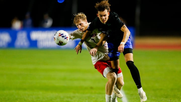 SIUE   s Aaron Crabtree (12) and Memphis' Anders Bordoy (28) collide during the first round NCAA tournament game between University of Memphis and Southern Illinois University Edwardsville in Memphis, Tenn., on Thursday, November 16, 2023. Memphis defeated SIUE 2-1.