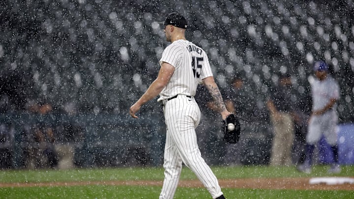 Aug 27, 2024; Chicago, Illinois, USA; Chicago White Sox starting pitcher Garrett Crochet (45) walks off the field during heavy rain in the first inning of a baseball game between the Chicago White Sox and Texas Rangers at Guaranteed Rate Field. Mandatory Credit: Kamil Krzaczynski-Imagn Images Aug 27, 2024; Chicago, Illinois, USA; Chicago White Sox starting pitcher Garrett Crochet (45) walks off the field during heavy rain in the first inning of a baseball game between the Chicago White Sox and Texas Rangers at Guaranteed Rate Field. Mandatory Credit: Kamil Krzaczynski-Imagn Images