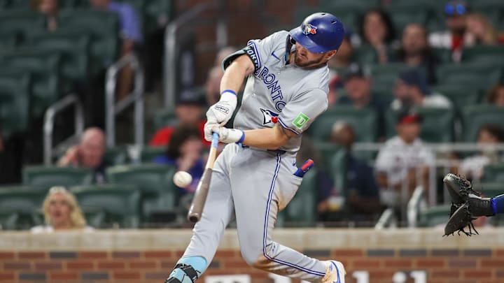 Sep 7, 2024; Atlanta, Georgia, USA; Toronto Blue Jays first baseman Spencer Horwitz (48) hits a single against the Atlanta Braves in the ninth inning at Truist Park. Mandatory Credit: Brett Davis-Imagn Images