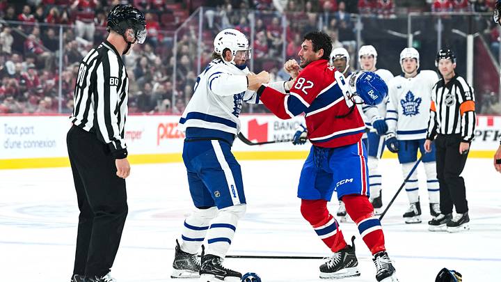 Sep 19, 2026; Montreal, Quebec, CAN;  Montreal Canadiens Lucas Condotta left wing (82) and Toronto Maple Leafs Michael Pezzetta left wing (61) fight during the first period at Bell Centre.  Mandatory Credit: David Kirouac-Imagn Images