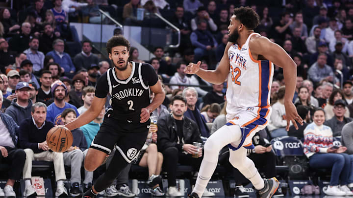 Nov 17, 2024; New York, New York, USA;  Brooklyn Nets forward Cameron Johnson (2) looks to drive past New York Knicks center Karl-Anthony Towns (32) in the first quarter at Madison Square Garden. Mandatory Credit: Wendell Cruz-Imagn Images
