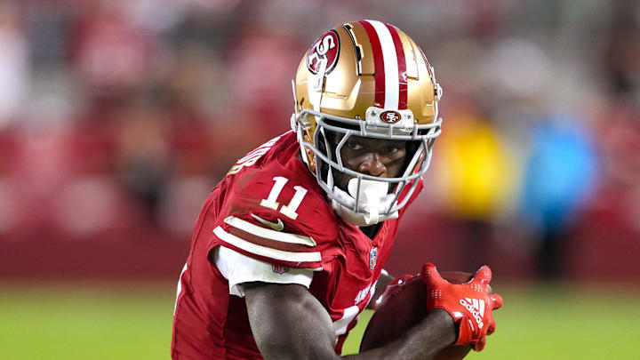 Sep 9, 2024; Santa Clara, California, USA; San Francisco 49ers wide receiver Brandon Aiyuk (11) runs after a catch against the New York Jets during the fourth quarter at Levi's Stadium. Mandatory Credit: Darren Yamashita-Imagn Images