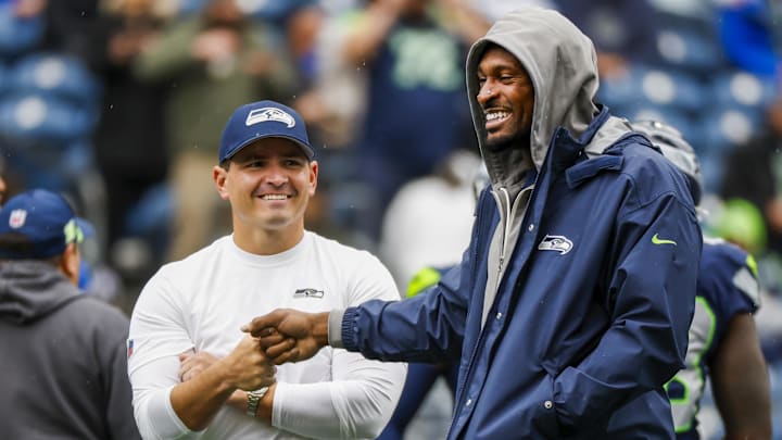 Oct 27, 2024; Seattle, Washington, USA; Seattle Seahawks head coach Mike Macdonald, left, bumps fists with wide receiver DK Metcalf, right, during pregame warmups against the Buffalo Bills at Lumen Field. Oct 27, 2024; Seattle, Washington, USA; Seattle Seahawks head coach Mike Macdonald, left, bumps fists with wide receiver DK Metcalf, right, during pregame warmups against the Buffalo Bills at Lumen Field.
