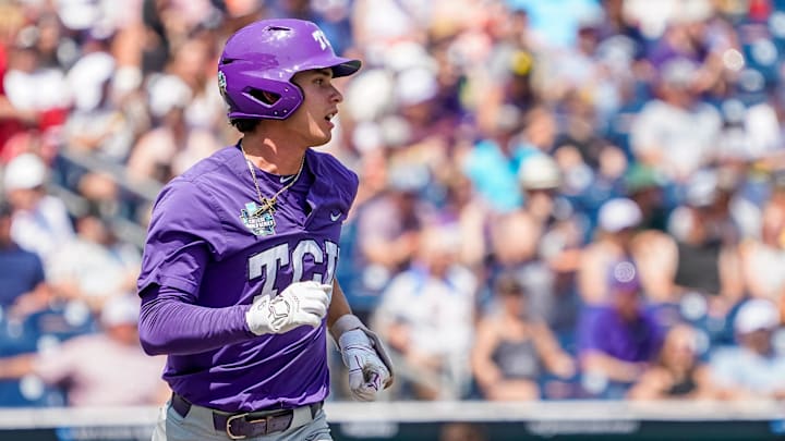Jun 18, 2023; Omaha, NE, USA;  TCU Horned Frogs shortstop Anthony Silva (5) runs to first after hitting a single against the Virginia Cavaliers during the sixth inning at Charles Schwab Field Omaha. Mandatory Credit: Dylan Widger-Imagn Images
