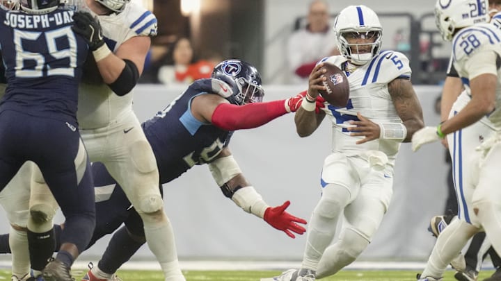 Dec 22, 2024; Indianapolis, Indiana, USA; Indianapolis Colts quarterback Anthony Richardson (5) is sacked by Tennessee Titans defensive tackle Jeffery Simmons (98) during a game against the Tennessee Titans at Lucas Oil Stadium. Mandatory Credit: Christine Tannous/USA Today Network via Imagn Images Dec 22, 2024; Indianapolis, Indiana, USA; Indianapolis Colts quarterback Anthony Richardson (5) is sacked by Tennessee Titans defensive tackle Jeffery Simmons (98) during a game against the Tennessee Titans at Lucas Oil Stadium. Mandatory Credit: Christine Tannous/USA Today Network via Imagn Images