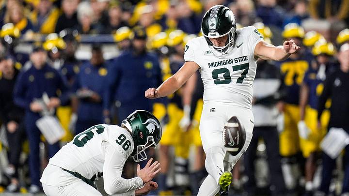 Michigan State place kicker Jonathan Kim (97) attempts a field goal against Michigan during the first half at Michigan Stadium in Ann Arbor on Saturday, Oct. 26, 2024. Michigan State place kicker Jonathan Kim (97) attempts a field goal against Michigan during the first half at Michigan Stadium in Ann Arbor on Saturday, Oct. 26, 2024.