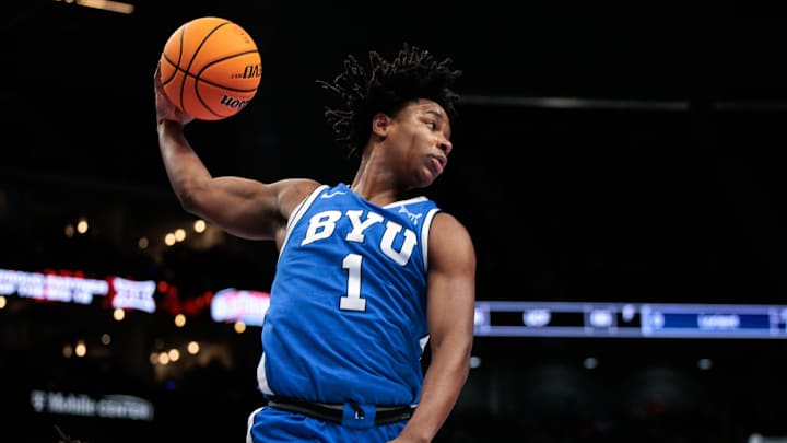 Mar 11, 2026; Kansas City, MO, USA; BYU Cougars guard Robert Wright III (1) rebounds during the first half against the West Virginia Mountaineers at T-Mobile Center. Mandatory Credit: William Purnell-Imagn Images