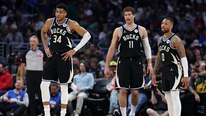 Mar 10, 2024; Los Angeles, California, USA;  Milwaukee Bucks forward Giannis Antetokounmpo (34) and center Brook Lopez (11) and guard Damian Lillard (0) on the court during the third quarter against the Los Angeles Clippers at Crypto.com Arena. Mandatory Credit: Kiyoshi Mio-Imagn Images