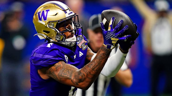 Jan 1, 2024; New Orleans, LA, USA; Washington Huskies wide receiver Ja'Lynn Polk (2) catches a touchdown pass during the second quarter against the Texas Longhorns in the 2024 Sugar Bowl college football playoff semifinal game at Caesars Superdome. Mandatory Credit: John David Mercer-USA TODAY Sports