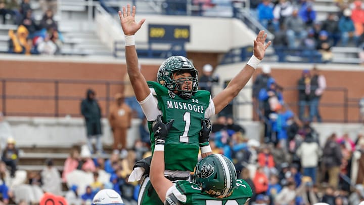 Muskogee celebrates a touchdown during the first half of the OSSAA 6AII State Football Championship Game at UCO in Edmond, Okla.