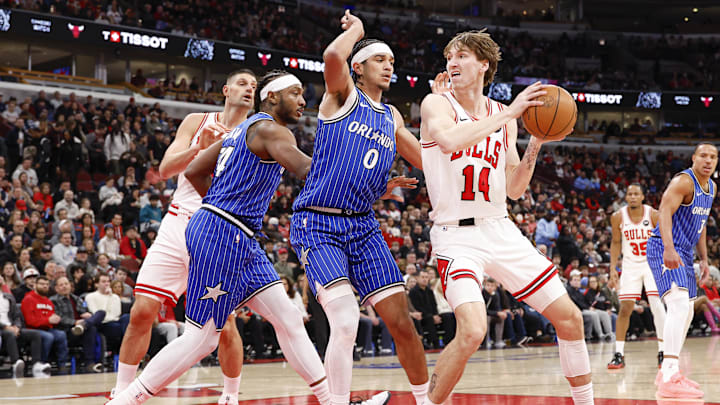 Jan 2, 2026; Chicago, Illinois, USA; Chicago Bulls forward Matas Buzelis (14) goes to the basket against Orlando Magic guard Anthony Black (0) during the first half at United Center. Mandatory Credit: Kamil Krzaczynski-Imagn Images