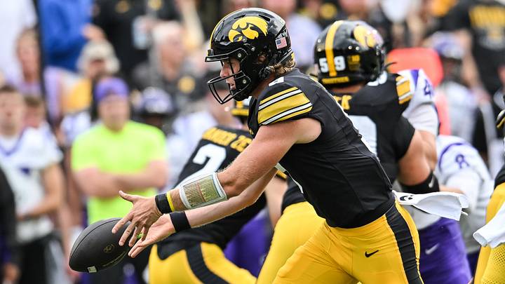 Sep 19, 2026; Iowa City, Iowa, USA;  Iowa Hawkeyes quarterback Hank Brown (9) tosses the ball off against the UNI Panthers during the first quarter at Kinnick Stadium.  Mandatory Credit: Jeffrey Becker-Imagn Images