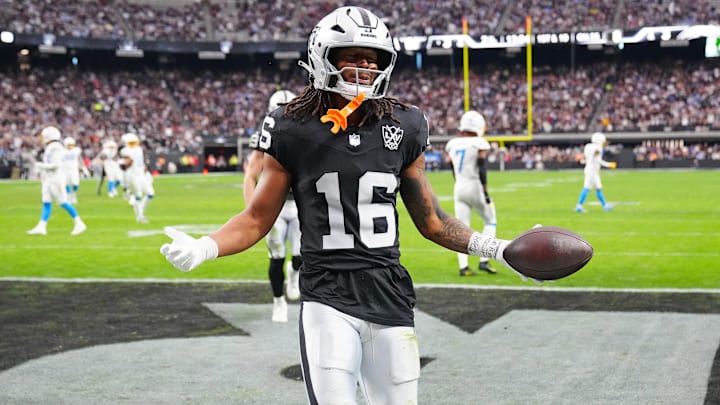 Jan 5, 2025; Paradise, Nevada, USA; Las Vegas Raiders wide receiver Jakobi Meyers (16) celebrates after scoring a touchdown against the Los Angeles Chargers during the second quarter at Allegiant Stadium.