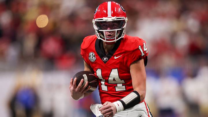Nov 28, 2025; Atlanta, Georgia, USA; Georgia Bulldogs quarterback Gunner Stockton (14) runs the ball against the Georgia Tech Yellow Jackets in the second quarter at Mercedes-Benz Stadium. Mandatory Credit: Brett Davis-Imagn Images Nov 28, 2025; Atlanta, Georgia, USA; Georgia Bulldogs quarterback Gunner Stockton (14) runs the ball against the Georgia Tech Yellow Jackets in the second quarter at Mercedes-Benz Stadium. Mandatory Credit: Brett Davis-Imagn Images