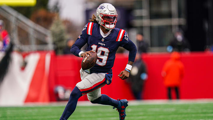 Jan 5, 2025; Foxborough, Massachusetts, USA; New England Patriots quarterback Joe Milton III (19) runs the ball against the Buffalo Bills in the first half at Gillette Stadium. Mandatory Credit: David Butler II-Imagn Images