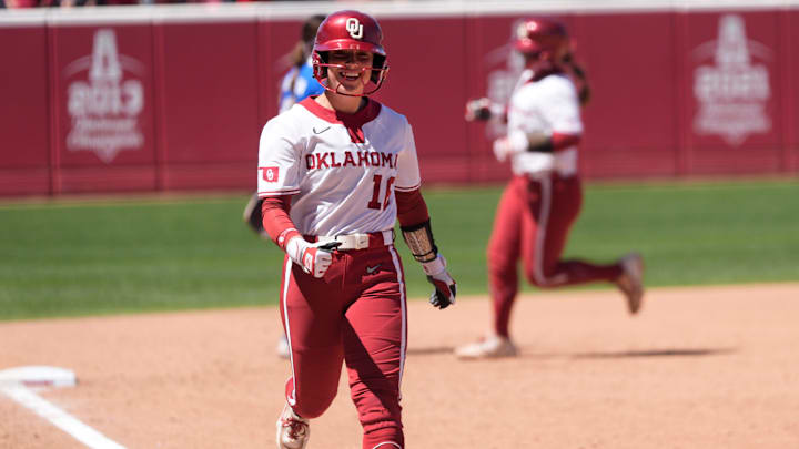 Oklahoma outfielder Abby Dayton was all smiles after the Sooners hit a home run against Kentucky.