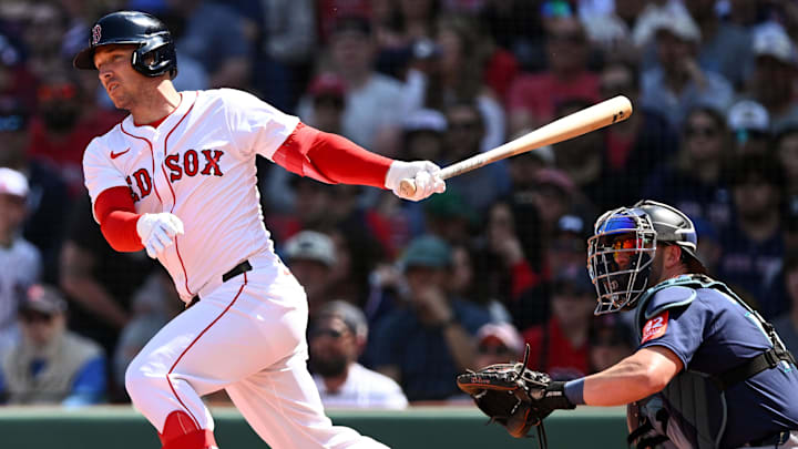 Apr 24, 2025; Boston, Massachusetts, USA; Boston Red Sox third base Alex Bregman (2) hits a RBI single against the Seattle Mariners during the third inning at Fenway Park. Mandatory Credit: Brian Fluharty-Imagn Images