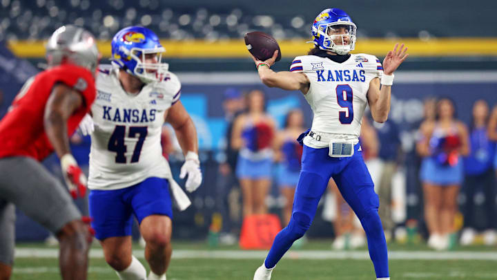 Dec 26, 2023; Phoenix, AZ, USA; Kansas Jayhawks quarterback Jason Bean (9) throws a pass during the