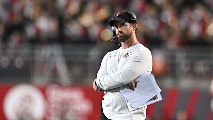Aug 30, 2025; Pullman, Washington, USA; Washington State Cougars head coach Jimmy Rogers watches a replay on the video board during a game against the Idaho Vandals in the second half at Gesa Field at Martin Stadium. Washington State Cougars won 13-10. Mandatory Credit: James Snook-Imagn Images