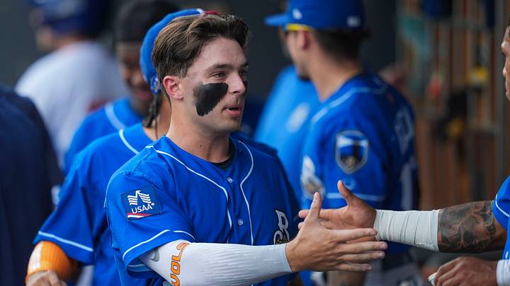 Biloxi Shuckers infielder Andrew Fischer (25) high-fives teammates after bringing in a run during a minor league baseball game between the Knoxville Smokies and Biloxi Shuckers at Covenant Health Park in Knoxville, Tenn., on July 7, 2026. Biloxi Shuckers infielder Andrew Fischer (25) high-fives teammates after bringing in a run during a minor league baseball game between the Knoxville Smokies and Biloxi Shuckers at Covenant Health Park in Knoxville, Tenn., on July 7, 2026.