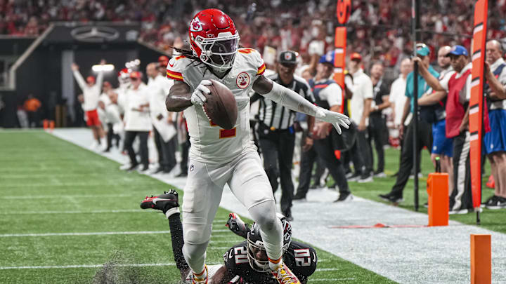 Sep 22, 2024; Atlanta, Georgia, USA; Kansas City Chiefs wide receiver Rashee Rice (4) scores a touchdown past Atlanta Falcons cornerback Dee Alford (20) during the first half at Mercedes-Benz Stadium. Mandatory Credit: Dale Zanine-Imagn Images