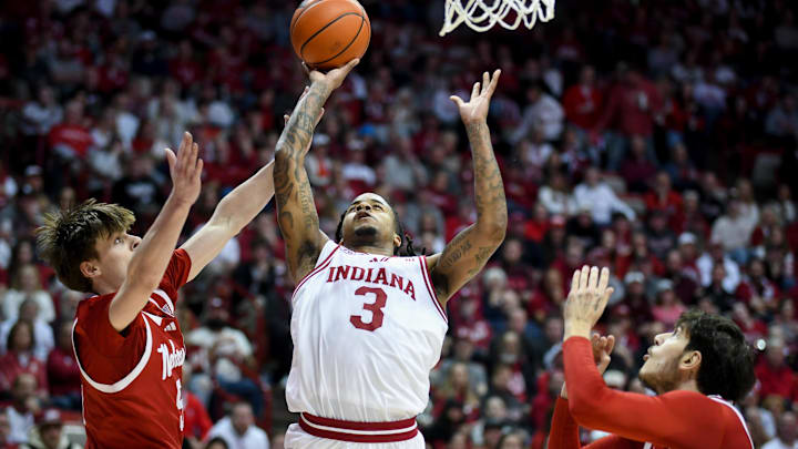 Jan 10, 2026; Bloomington, Indiana, USA; Indiana Hoosiers guard Lamar Wilkerson (3) scores past Nebraska Cornhuskers forward Braden Frager (5) during the first half at Simon Skjodt Assembly Hall.