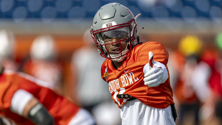 Jan 28, 2025; Mobile, AL, USA; National team wide receiver Kyle Williams of Washington State (11) sets up at the line during Senior Bowl practice for the National team at Hancock Whitney Stadium. Mandatory Credit: Vasha Hunt-Imagn Images