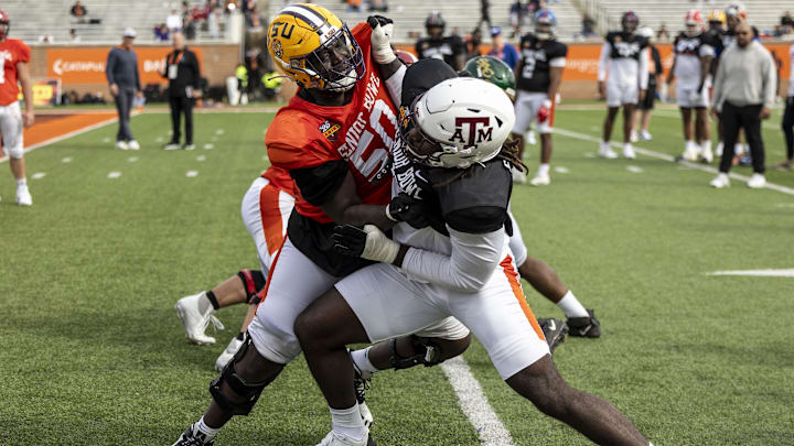 Jan 28, 2025; Mobile, AL, USA; American team offensive lineman Emery Jones of LSU (50) spars with American team defensive lineman Shemar Stewart of Texas A&M (14) during Senior Bowl practice for the American team at Hancock Whitney Stadium. Mandatory Credit: Vasha Hunt-Imagn Images Jan 28, 2025; Mobile, AL, USA; American team offensive lineman Emery Jones of LSU (50) spars with American team defensive lineman Shemar Stewart of Texas A&M (14) during Senior Bowl practice for the American team at Hancock Whitney Stadium. Mandatory Credit: Vasha Hunt-Imagn Images