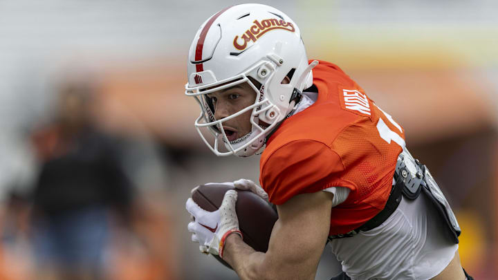 Jan 30, 2025; Mobile, AL, USA; National team wide receiver Jaylin Noel of Iowa State (12) works through drills during Senior Bowl practice for the National team at Hancock Whitney Stadium. Mandatory Credit: Vasha Hunt-Imagn Images