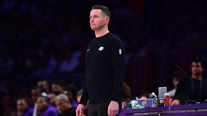 Dec 23, 2024; Los Angeles, California, USA; Los Angeles Lakers head coach JJ Redick watches game action against the Detroit Pistons during the first half at Crypto.com Arena. Mandatory Credit: Gary A. Vasquez-Imagn Images