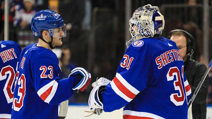 Apr 16, 2022; New York, New York, USA; New York Rangers defenseman Adam Fox (23) celebrates a 4-0 win against the Detroit Red Wings with New York Rangers goalie Igor Shesterkin (31) at Madison Square Garden. Mandatory Credit: Danny Wild-Imagn Images